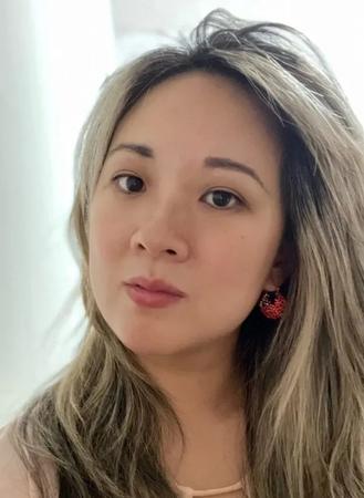 Color photo portrait of Eve J. Chung