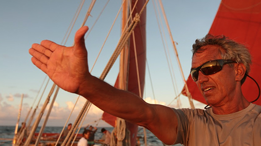 Nainoa Thompson navigating on a boat