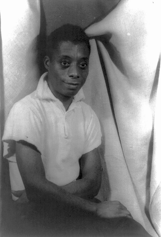 Black and white photo of James Baldwin as a young man in 1955