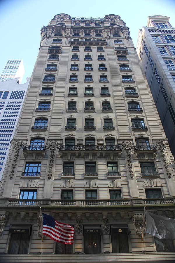 Color photo looking up the facade of the St. Regis, one-time meeting place of the Usage Panel, in New York City from Fifth Avenue
